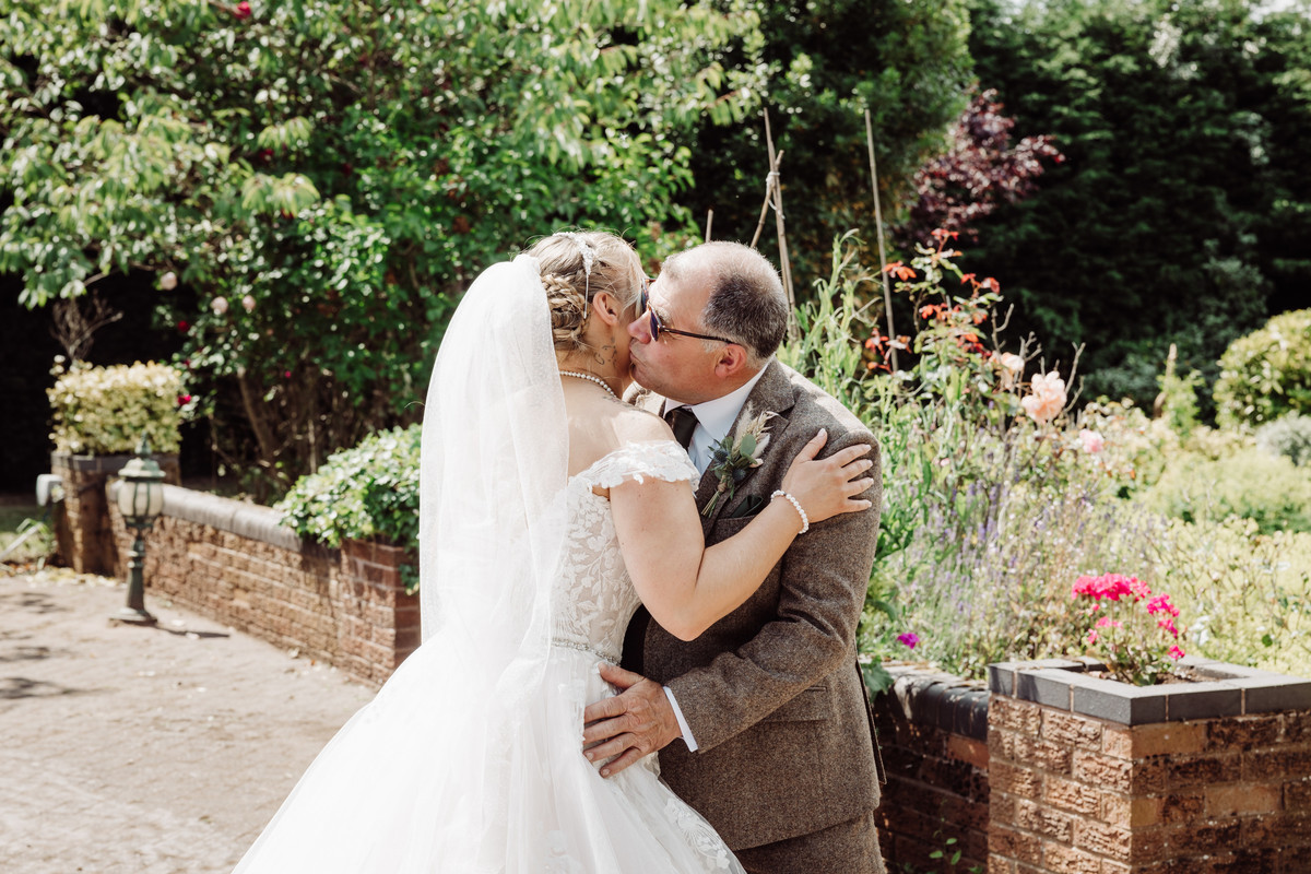 Wedding photographer captures first look with Dad on a farm in Staffordshire