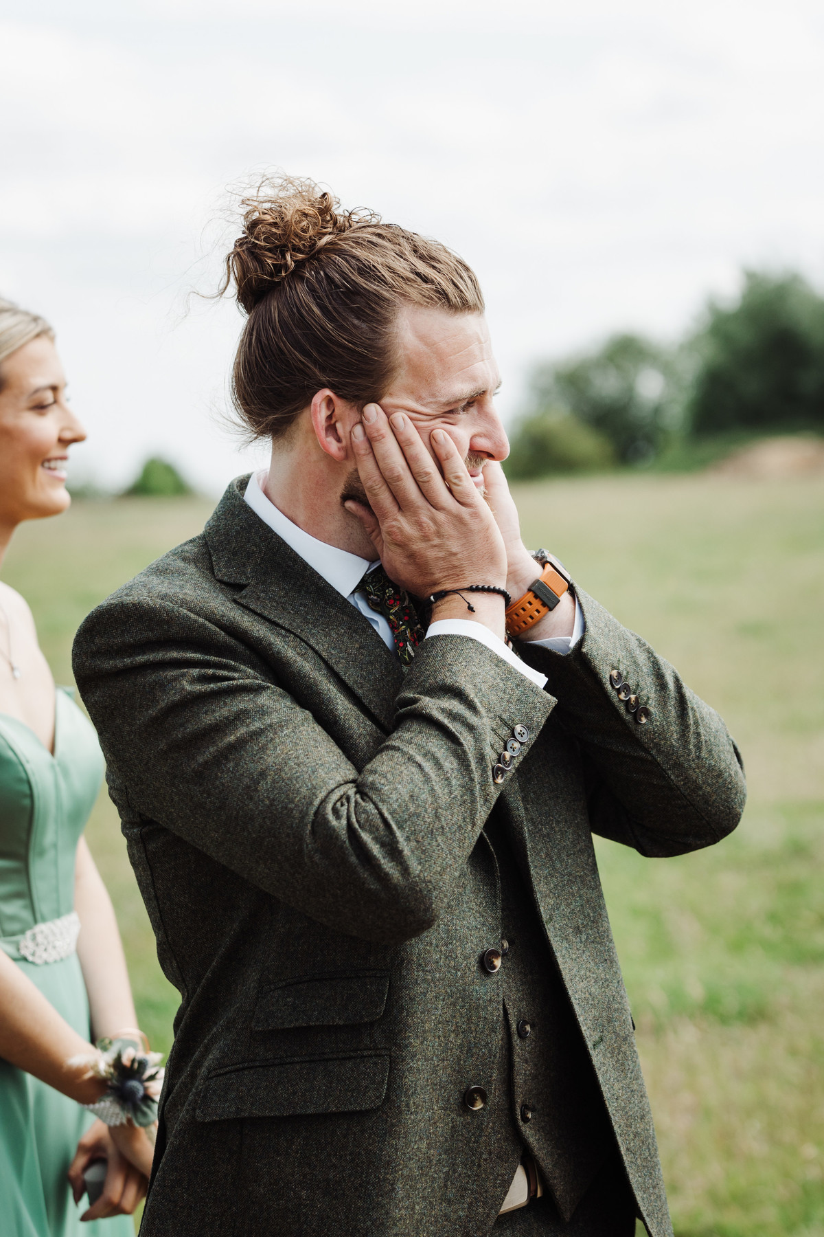 Groom gasping with emotion at seeing his beautiful bride
