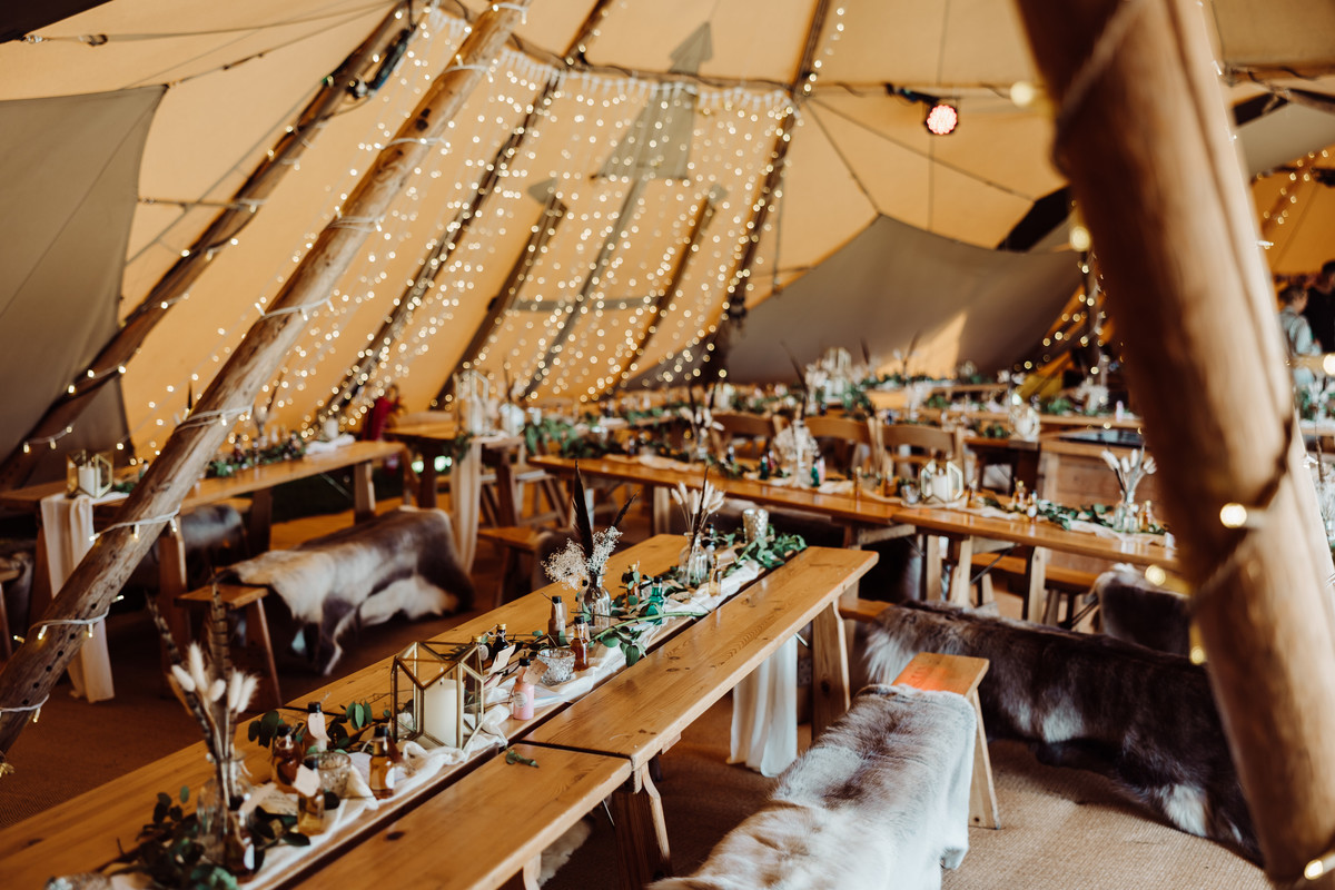 Rustic table decor in a tipi at a farm wedding in Staffordshire
