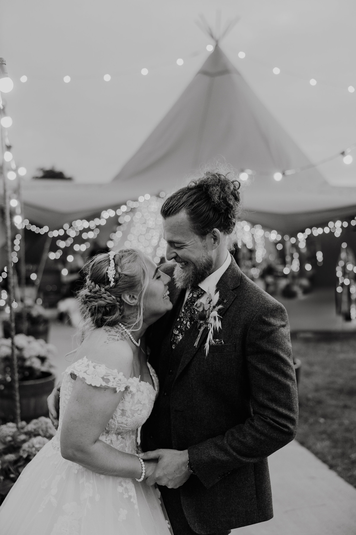 Bride and groom laugh together at the end of their wedding day in Staffordshire