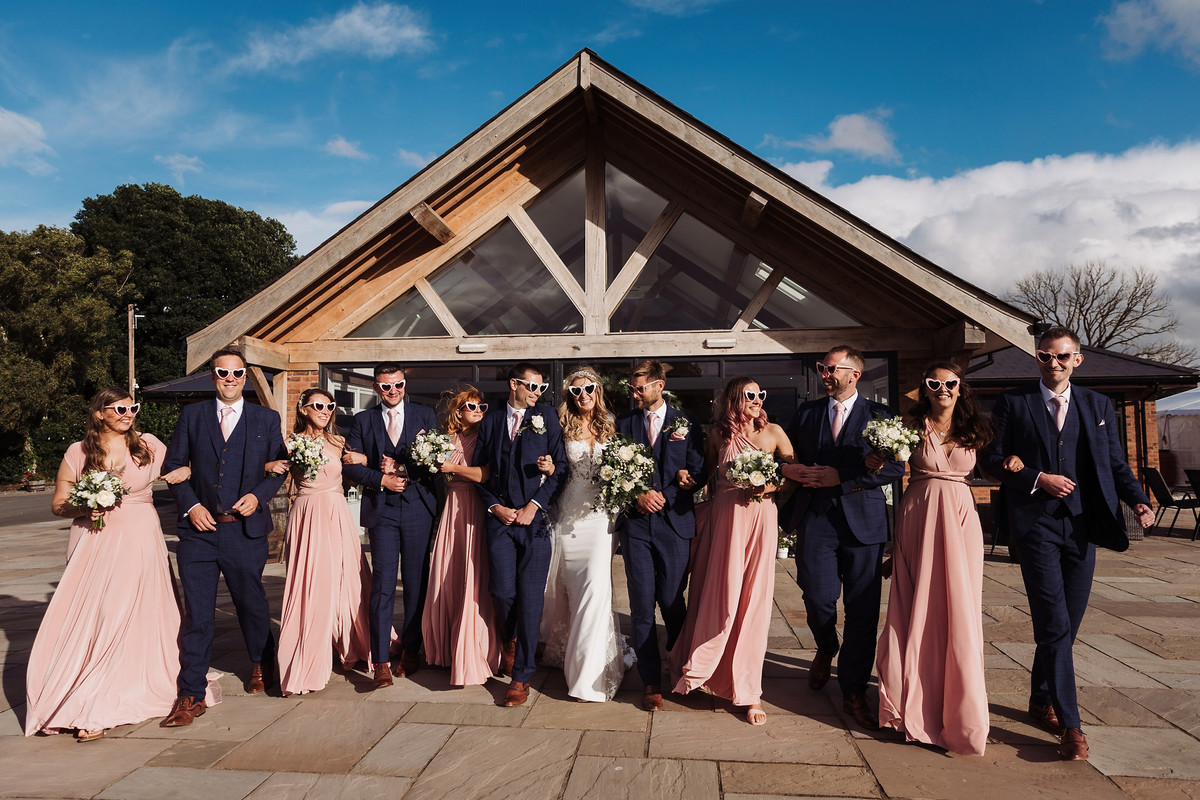 Bridal party during drinks reception at Blithfield Lakeside Barns