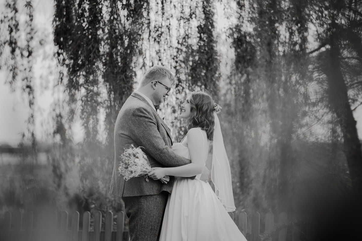 Black and white image of bride and groom at Hanbury wedding barns