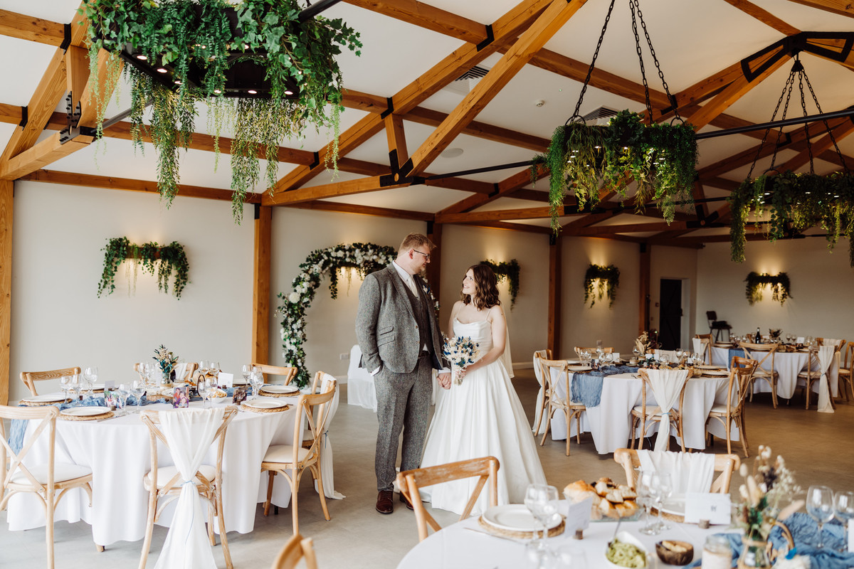 Bride and groom inside the barn at Hanbury wedding barns
