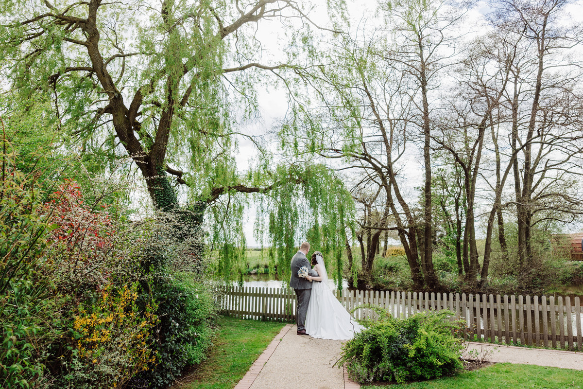 Bride and Groom in the gardens at Hanbury Wedding Barns