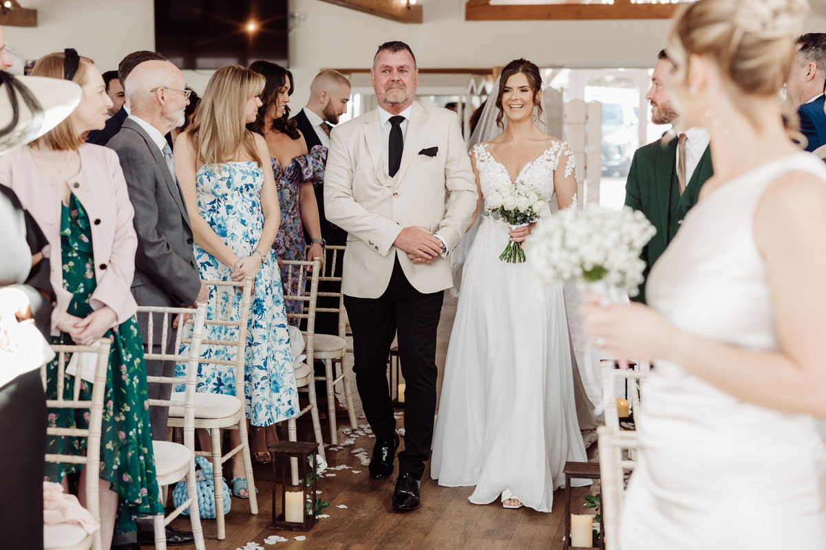 Proud Dad's wells up as he walks his daughter down the aisle at Blithfield Lakeside Barns