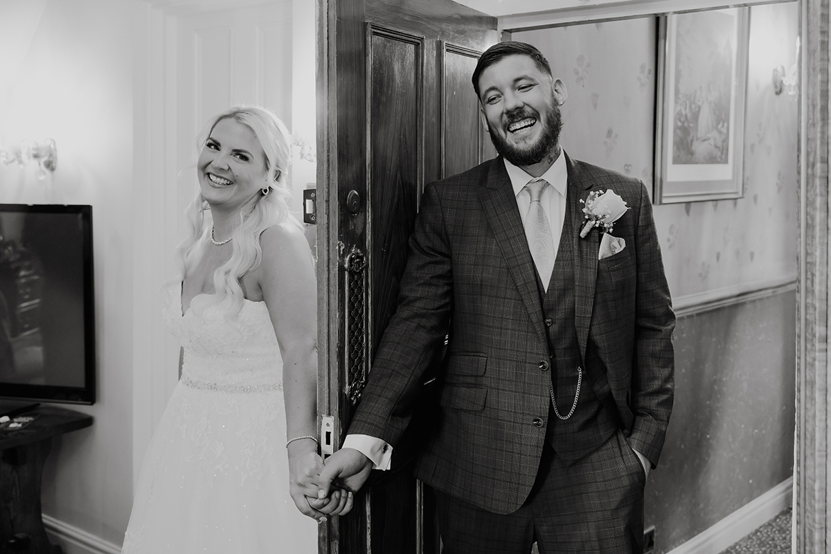 Nikki and Dan having a first touch before their Hundred House Hotel wedding ceremony