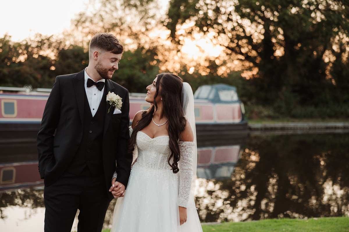 Bride and groom having softer evening wedding portraits later in the day
