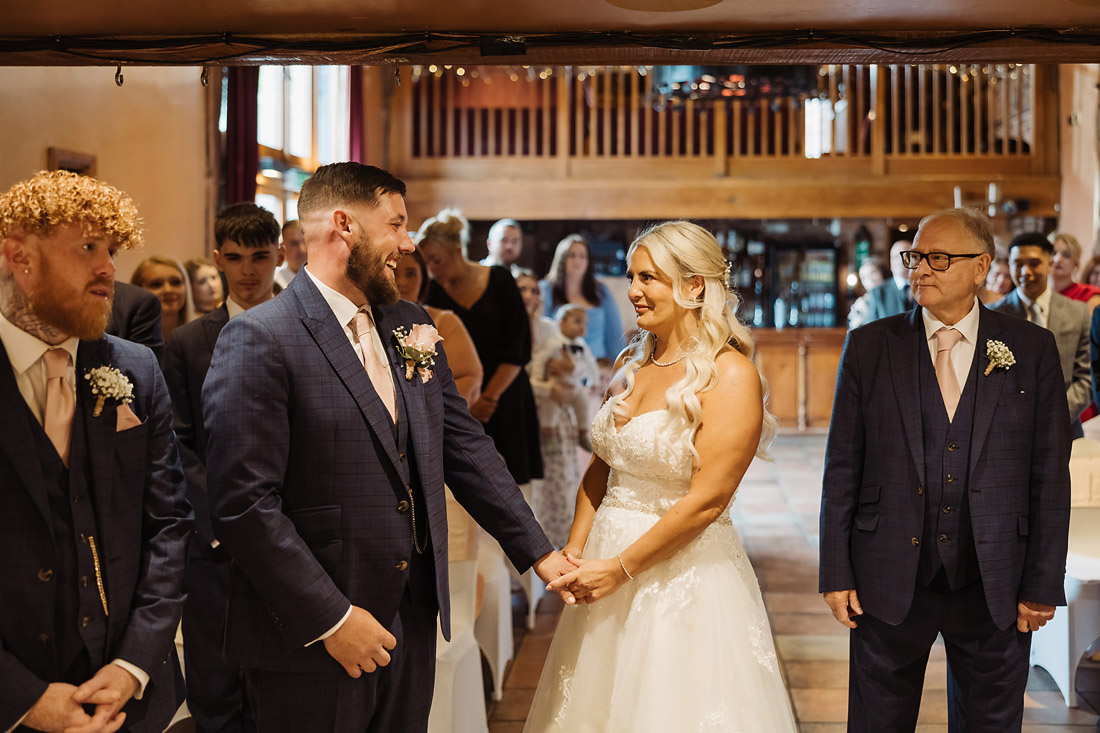 Groom seeing bride for the first time at Hundred House Hotel wedding