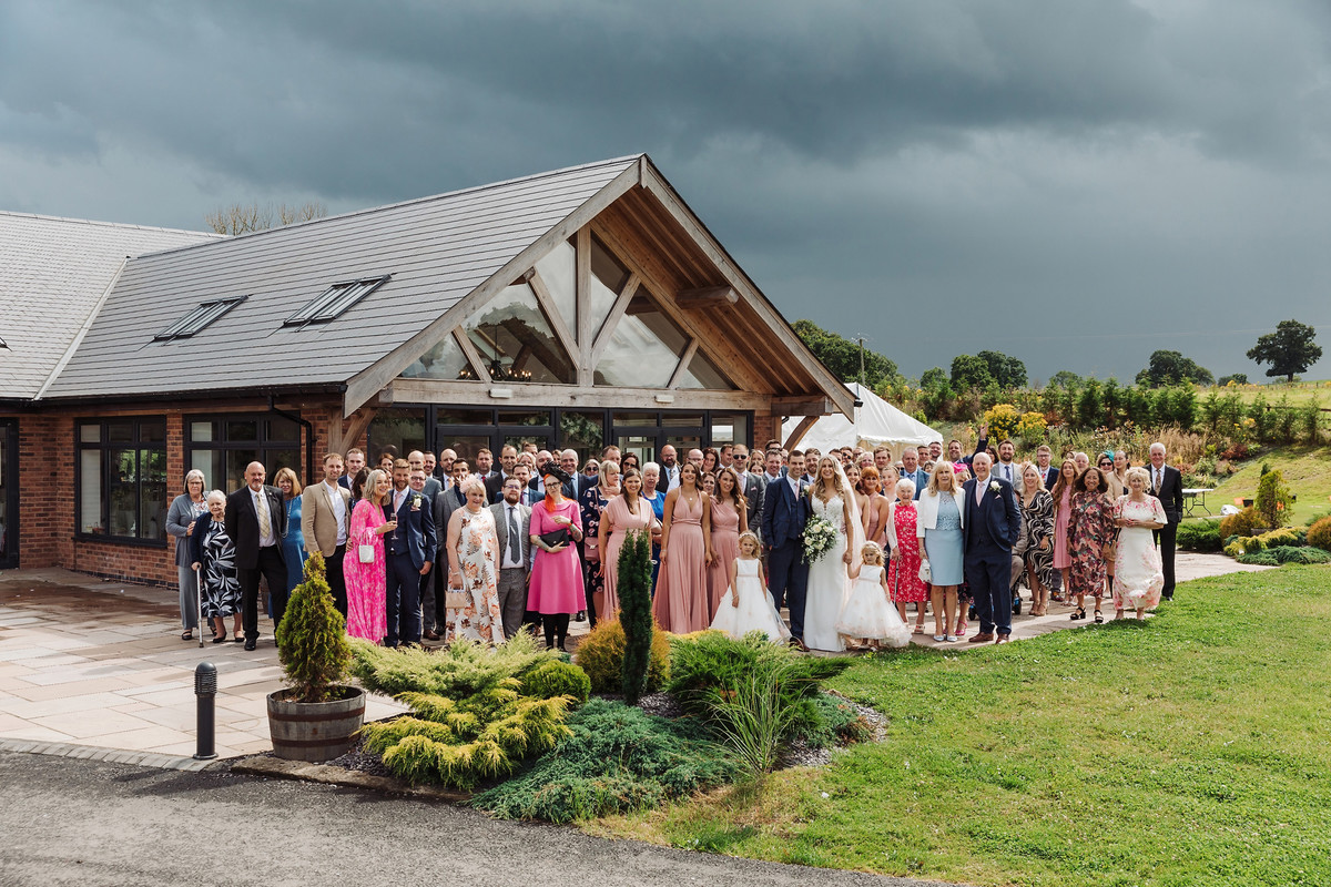 Large group wedding photograph at Blithfield Lakeside Barns