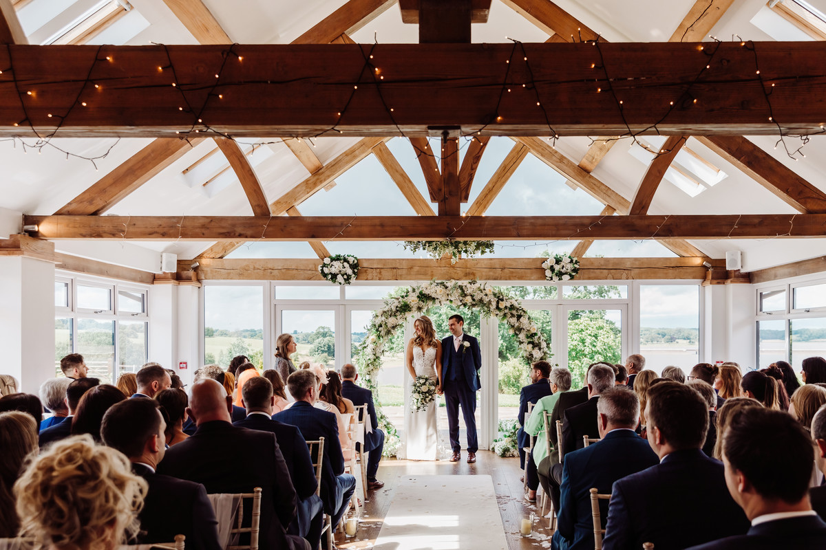 Ceremony in wedding barn at Blithfield Lakeside Barn