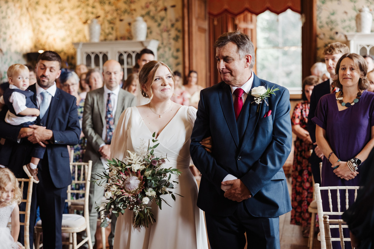 Dad gets emotional during the aisle walk at Sandon Hall