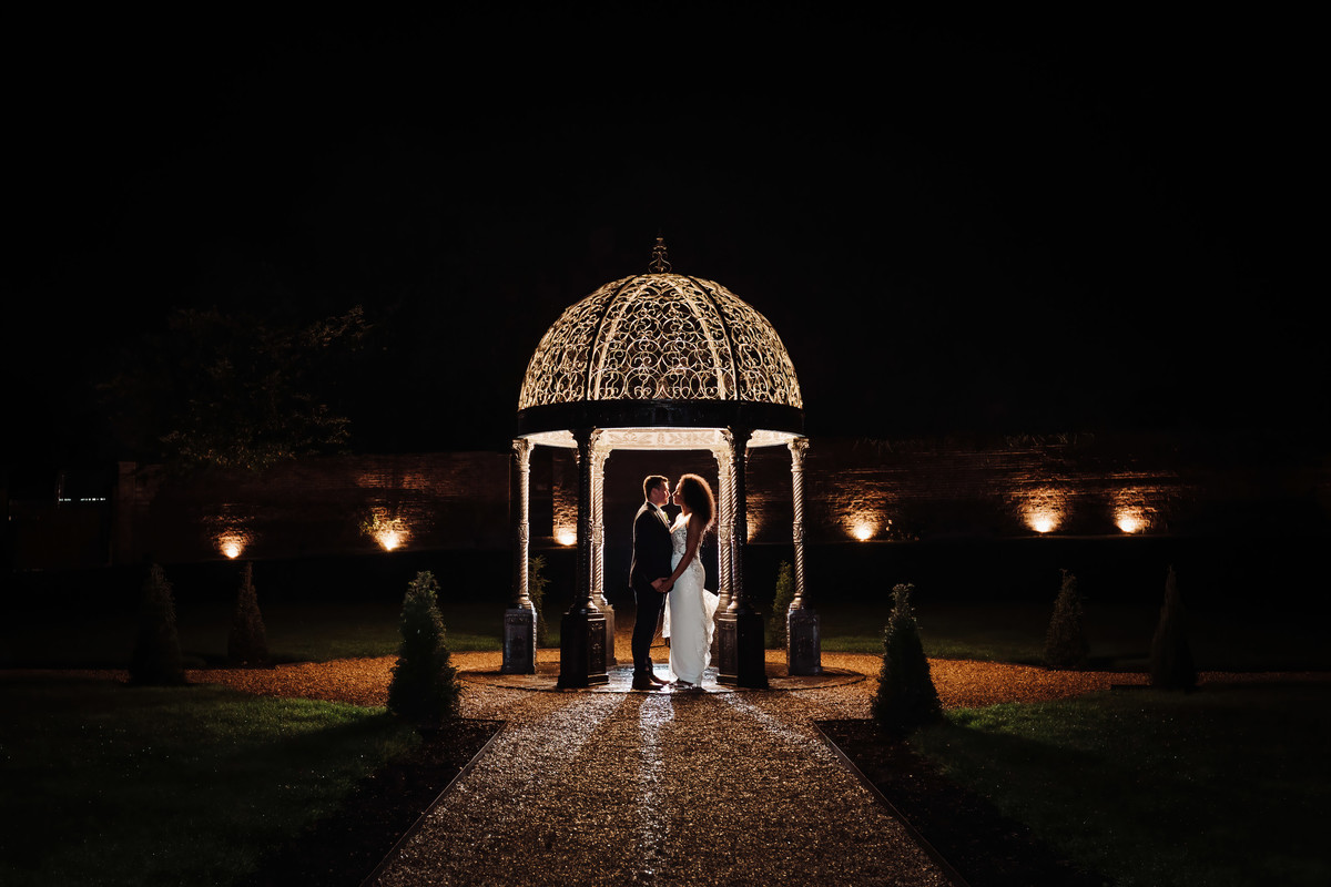 Bride and Groom in the gardens at night at Foxtail Barns, Staffordshire