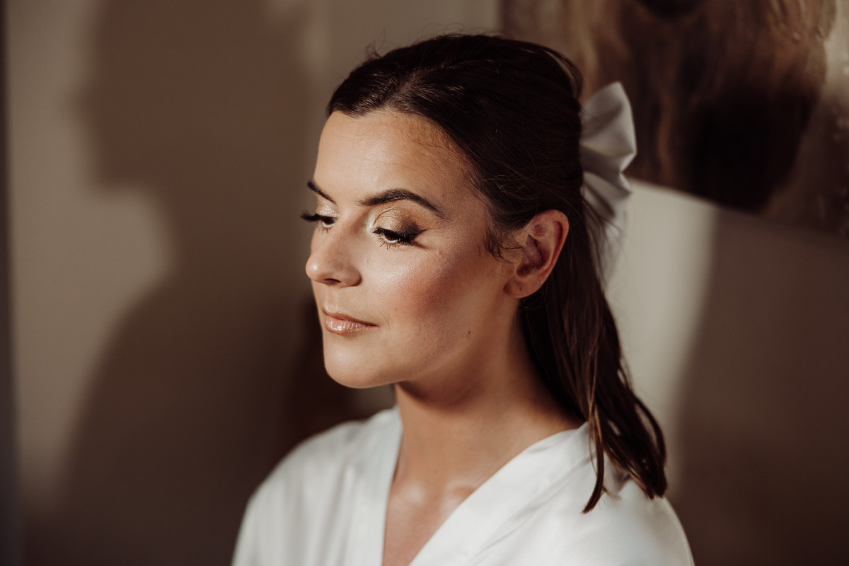 Beautiful bride takes a moment of reflection at Blithfield Lakeside Barns