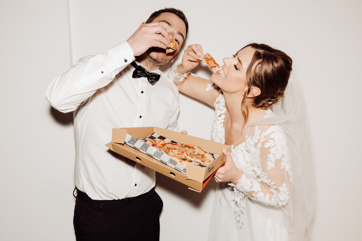 Bride and Groom eat pizza at Blithfield Lakeside Barns