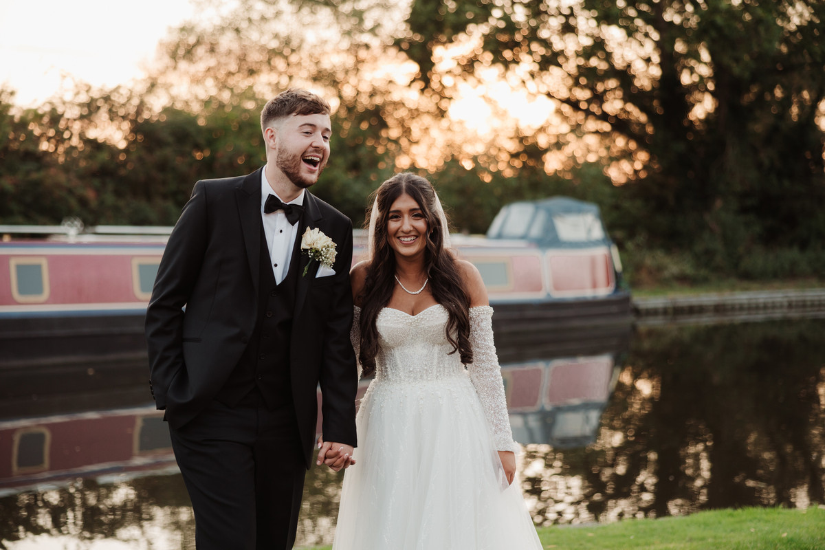 Bride and groom laugh naturally together at The Moat House, Staffordshire