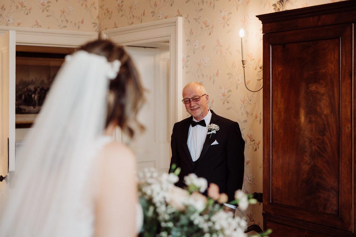Proud Dad beams at his daughter on her wedding day at Sandon Hall