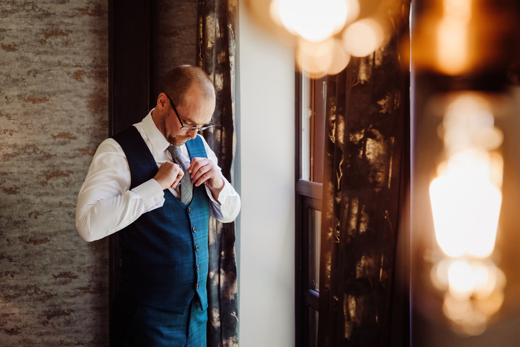 Groom gets ready at The Mill Barns