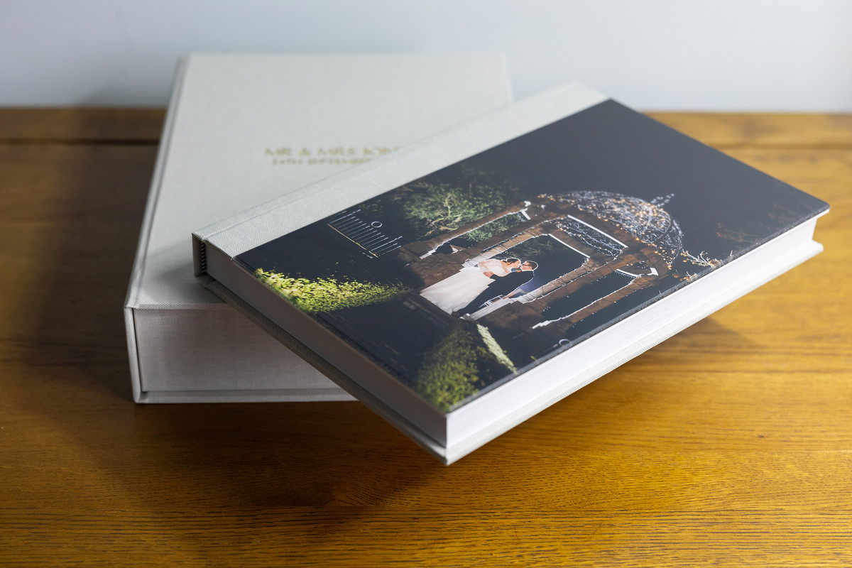 Wedding album by Samantha Lowe on a desk