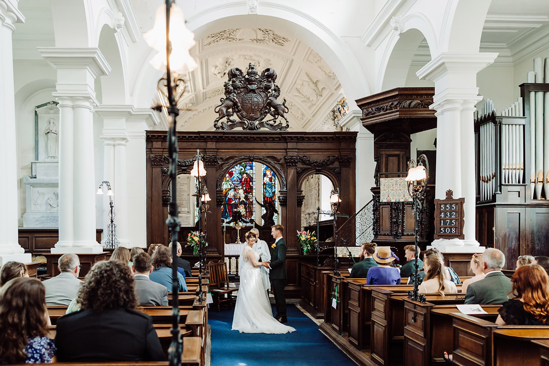 bride and groom exchange vows at ingestre church